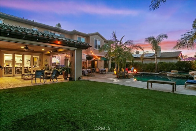 29291 Via Zamora, San Juan Capistrano, CA 92675 - back of property with a yard, a patio, a pool with connected hot tub, and a ceiling fan