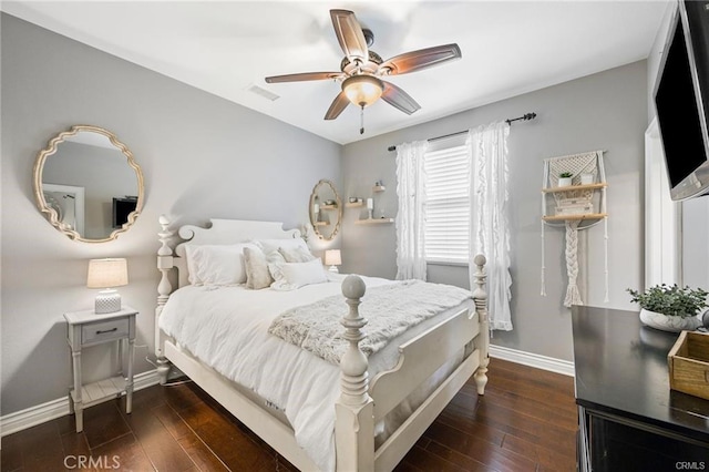 bedroom with baseboards, a ceiling fan, dark wood-style flooring, and visible vents