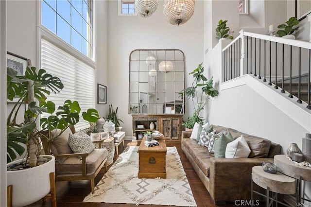 29291 Via Zamora, San Juan Capistrano, CA 92675 - living area featuring a high ceiling, wood finished floors, stairs, and a chandelier