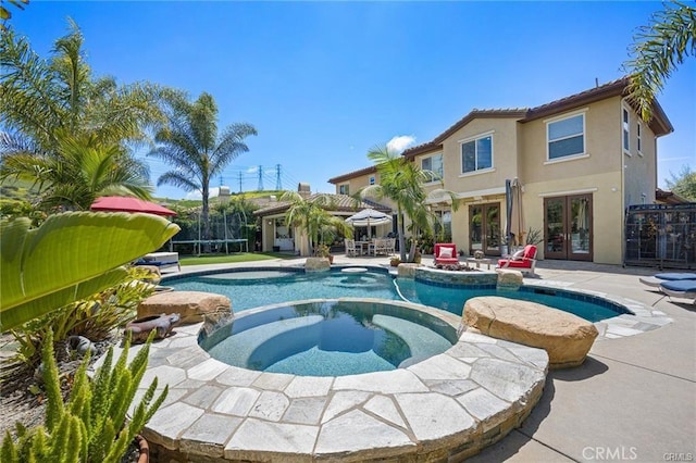 29291 Via Zamora, San Juan Capistrano, CA 92675 - view of swimming pool featuring french doors, a patio, and a pool with connected hot tub