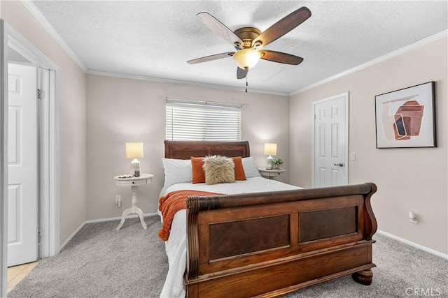 bedroom with crown molding, baseboards, and light colored carpet
