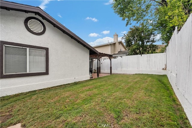 view of yard with a fenced backyard and a patio area