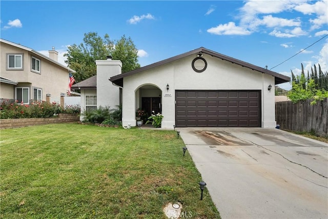 single story home with a garage, a front lawn, fence, stucco siding, and driveway