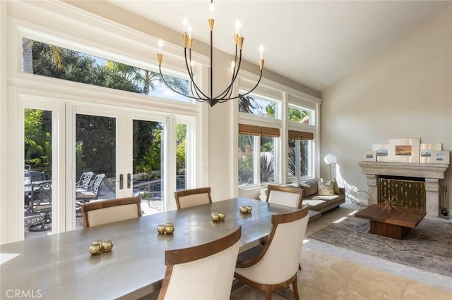sunroom / solarium with an inviting chandelier and french doors