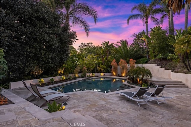 view of swimming pool featuring a fenced in pool and a patio area