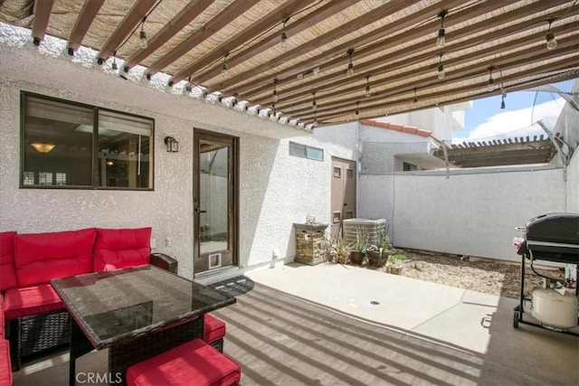 view of patio / terrace featuring fence and grilling area
