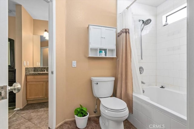 bathroom featuring vanity, shower / tub combo with curtain, toilet, baseboards, and tile patterned floors
