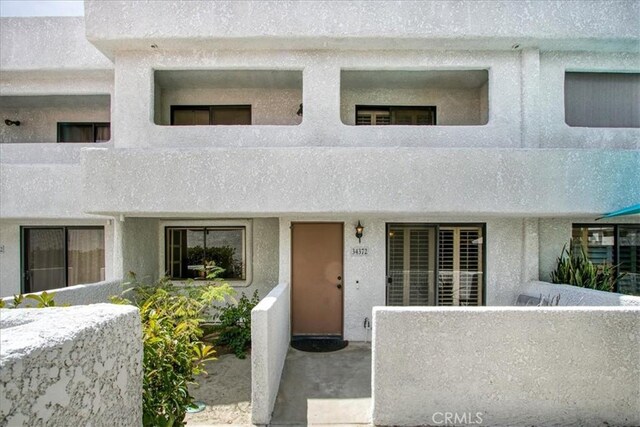 view of front of house featuring stucco siding