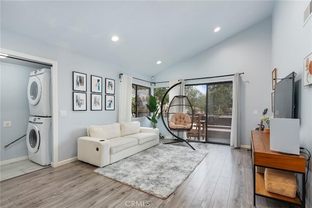 22844 Hilton Head Dr Unit 170, Diamond Bar, CA 91765 - living area featuring stacked washer and dryer, visible vents, recessed lighting, wood finished floors, and vaulted ceiling