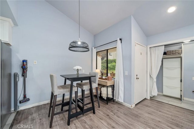 22844 Hilton Head Dr Unit 170, Diamond Bar, CA 91765 - dining room featuring baseboards, light wood-type flooring, and high vaulted ceiling