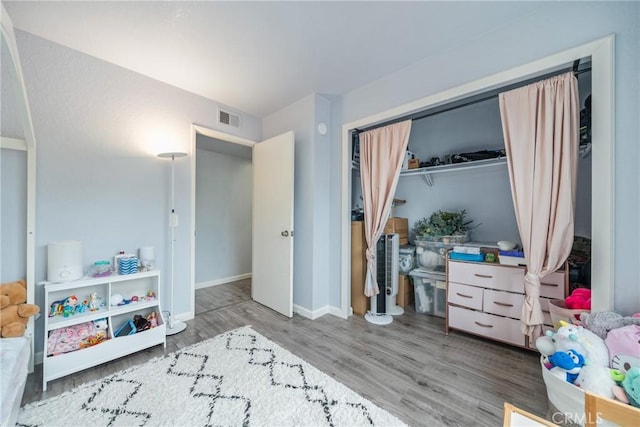 22844 Hilton Head Dr Unit 170, Diamond Bar, CA 91765 - bedroom with visible vents, baseboards, wood finished floors, and a closet