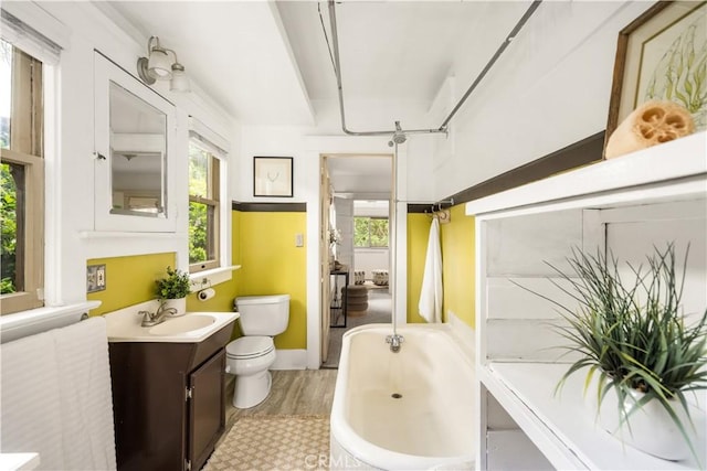 1559 Diamond Ave, South Pasadena, CA 91030 - bathroom with wood finished floors, a wealth of natural light, toilet, and a washtub