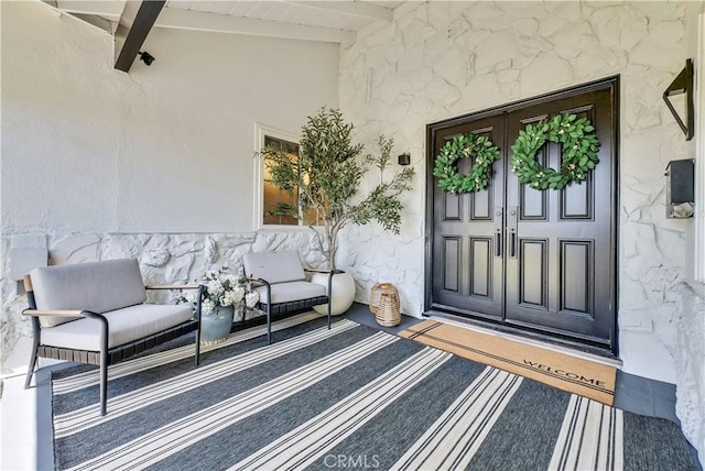 1467 N Kathleen Ln, Orange, CA 92867 - doorway to property featuring stucco siding, a porch, and stone siding