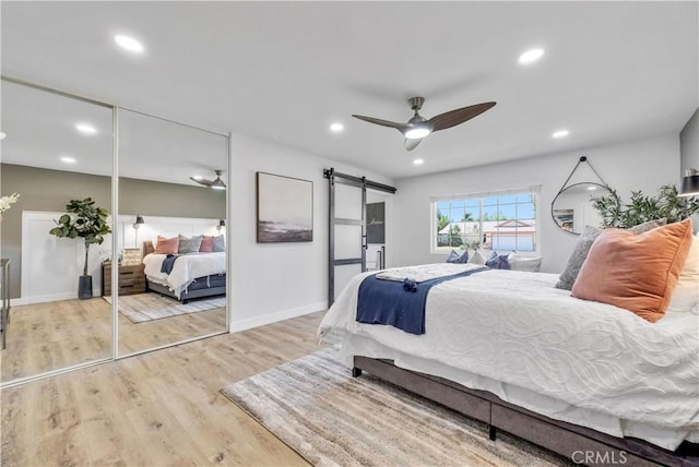 1467 N Kathleen Ln, Orange, CA 92867 - bedroom with baseboards, recessed lighting, a barn door, and wood finished floors