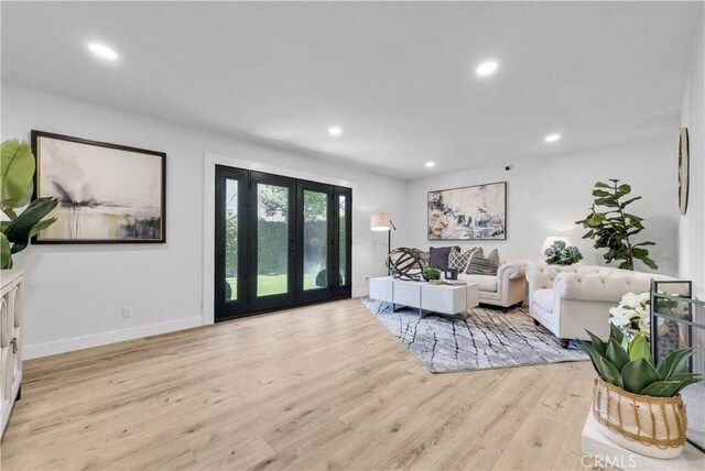 1467 N Kathleen Ln, Orange, CA 92867 - living room with recessed lighting, light wood finished floors, baseboards, and french doors