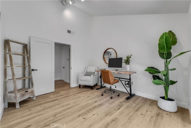 1467 N Kathleen Ln, Orange, CA 92867 - office area featuring baseboards, visible vents, wood finished floors, and a towering ceiling