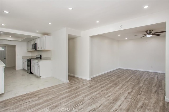 636 Harding Dr, Redlands, CA 92373 - kitchen with light countertops, range with gas stovetop, recessed lighting, stainless steel microwave, and open floor plan