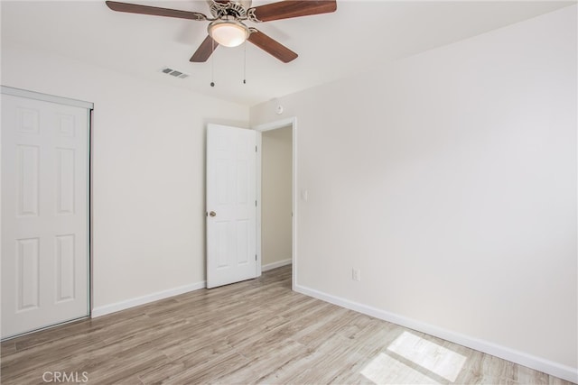 636 Harding Dr, Redlands, CA 92373 - unfurnished bedroom with ceiling fan, visible vents, wood finished floors, baseboards, and a closet