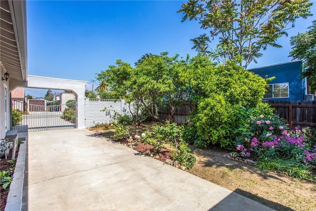 636 Harding Dr, Redlands, CA 92373 - view of patio / terrace with a gate, a carport, fence private yard, and driveway