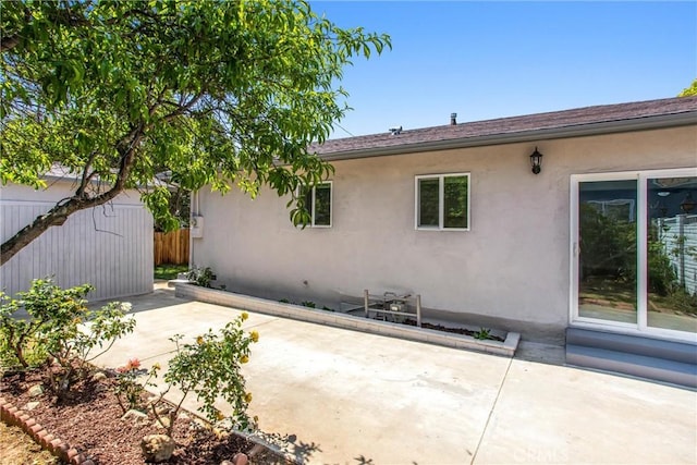 636 Harding Dr, Redlands, CA 92373 - rear view of property featuring fence, a patio, and stucco siding