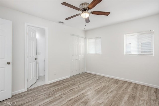 636 Harding Dr, Redlands, CA 92373 - unfurnished bedroom featuring light wood-type flooring, baseboards, visible vents, and a closet