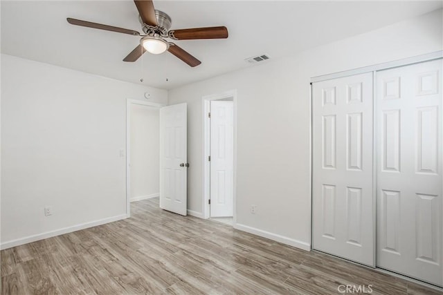 636 Harding Dr, Redlands, CA 92373 - unfurnished bedroom featuring visible vents, a closet, wood finished floors, baseboards, and a ceiling fan