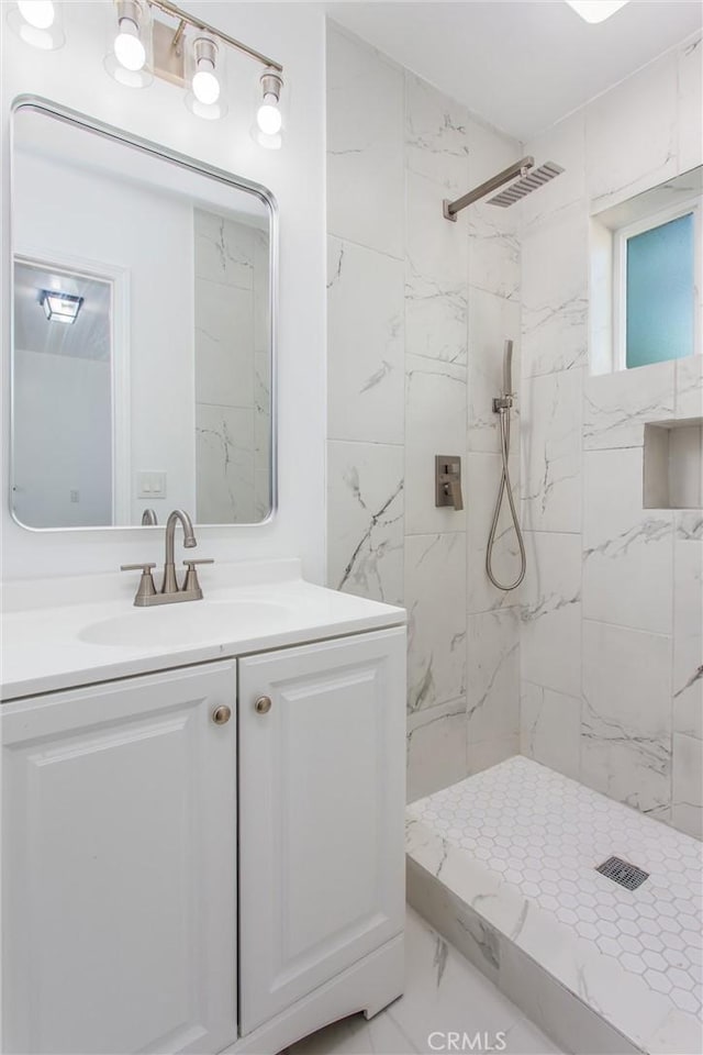 636 Harding Dr, Redlands, CA 92373 - bathroom featuring vanity, tiled shower, and marble finish floor