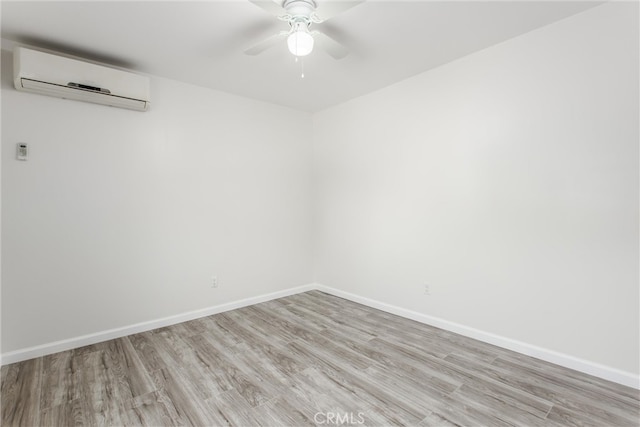 636 Harding Dr, Redlands, CA 92373 - empty room with light wood-style floors, baseboards, ceiling fan, and a wall mounted AC