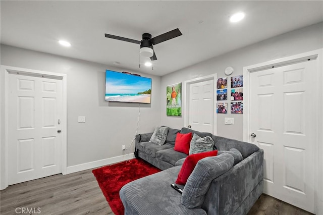 living room with baseboards, ceiling fan, recessed lighting, and wood finished floors