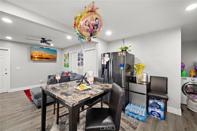 dining area featuring washer / dryer, baseboards, recessed lighting, and wood finished floors