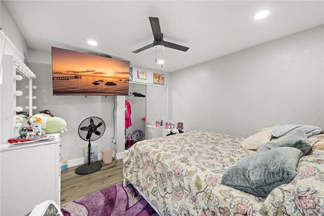 bedroom featuring recessed lighting, baseboards, ceiling fan, and wood finished floors