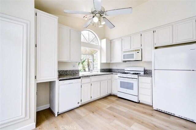 kitchen featuring white appliances, a ceiling fan, white cabinets, and light wood-style floors