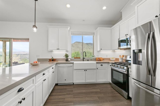 kitchen featuring a sink, light countertops, white cabinets, and stainless steel appliances