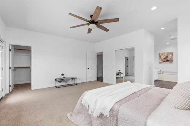 bedroom featuring a ceiling fan, light colored carpet, baseboards, connected bathroom, and recessed lighting