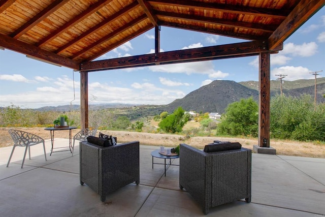 view of patio / terrace with a mountain view and outdoor lounge area