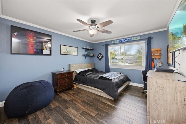 bedroom with baseboards, ornamental molding, and wood finished floors