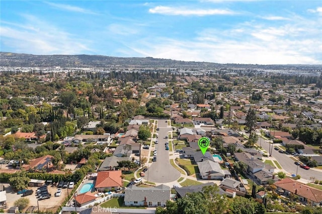 birds eye view of property with a residential view