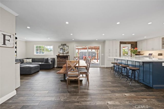 dining area featuring recessed lighting, ornamental molding, baseboards, and dark wood-type flooring
