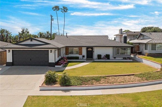 single story home with a garage, a front yard, and concrete driveway