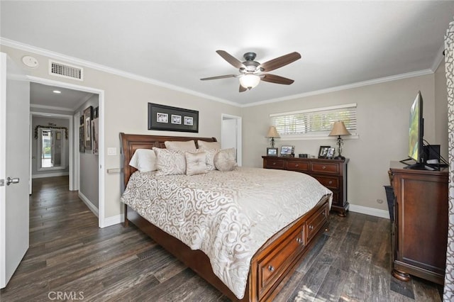 bedroom with dark wood-style flooring, baseboards, visible vents, and multiple windows