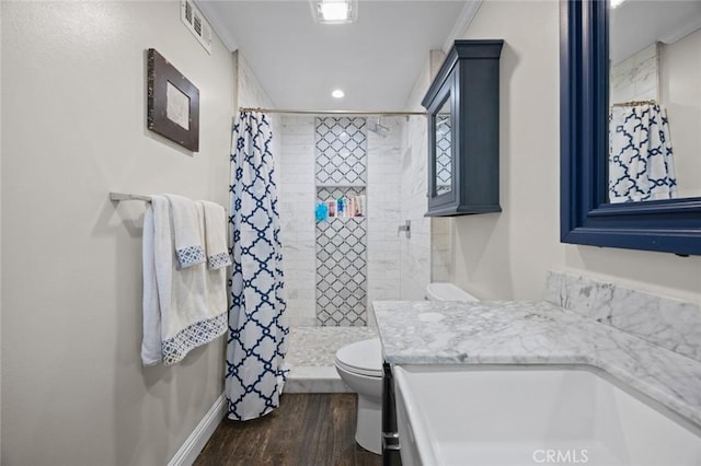 full bathroom with visible vents, a tile shower, wood finished floors, toilet, and recessed lighting