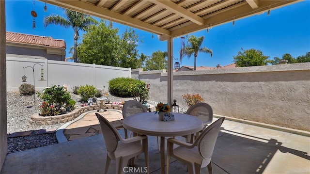 view of patio / terrace featuring outdoor dining area and a fenced backyard