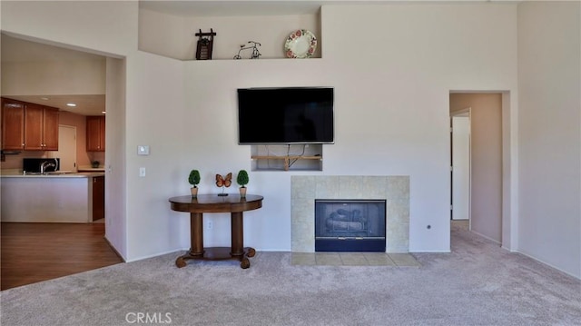 carpeted living room with a fireplace