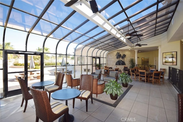 sunroom featuring ceiling fan and outdoor dining area