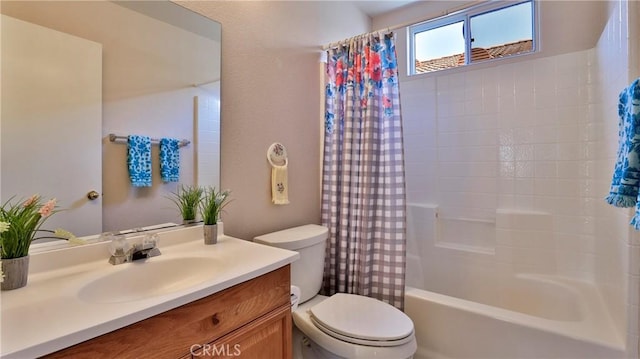 bathroom featuring toilet, shower / tub combo with curtain, and vanity