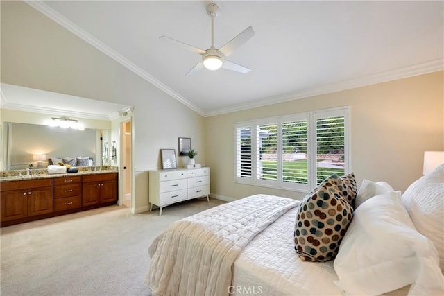 bedroom featuring crown molding, ceiling fan, light colored carpet, ensuite bathroom, and vaulted ceiling