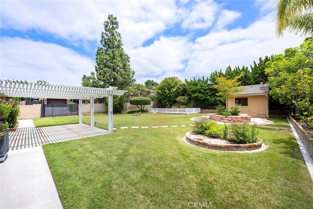 view of yard with fence, a pergola, and a patio area