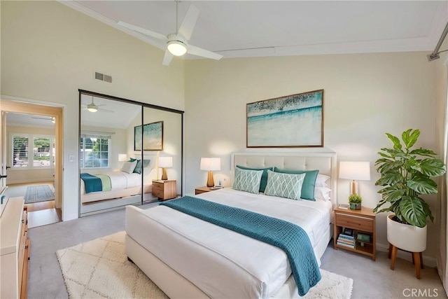 bedroom featuring visible vents, ornamental molding, carpet, and vaulted ceiling