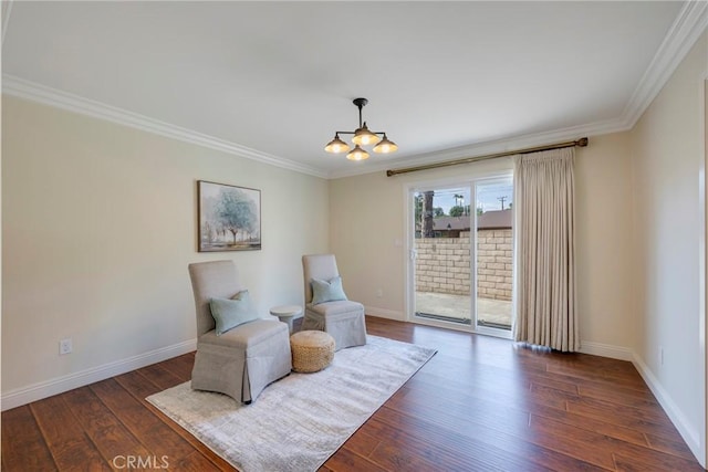 sitting room featuring crown molding, dark wood finished floors, baseboards, and a chandelier
