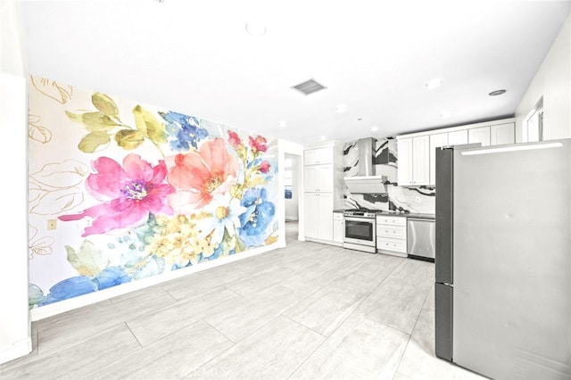 kitchen featuring visible vents, recessed lighting, appliances with stainless steel finishes, and white cabinets